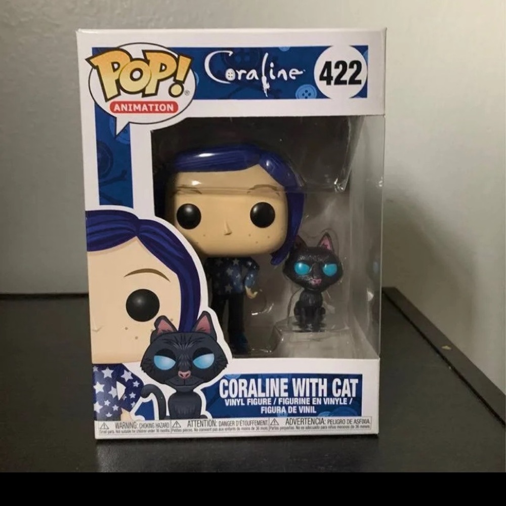 Coraline with cat funko pop with protector.